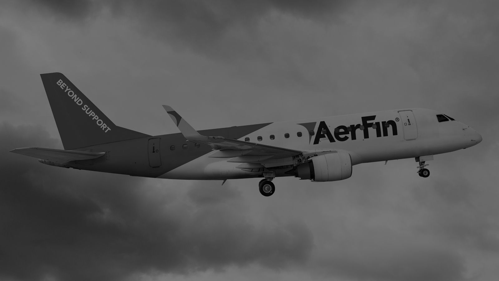 Photo of plane flying through the sky with Aerfin logo on it