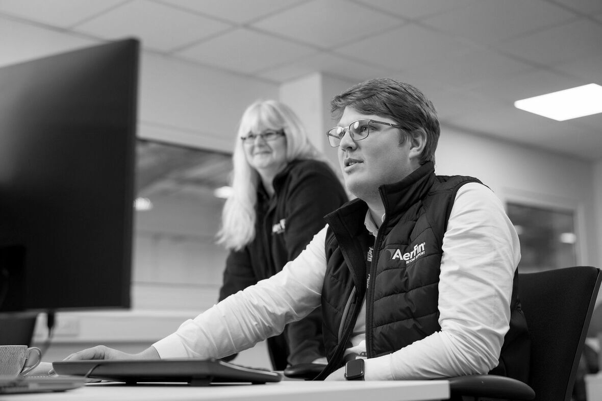 Aerfin staff on a computer in the office